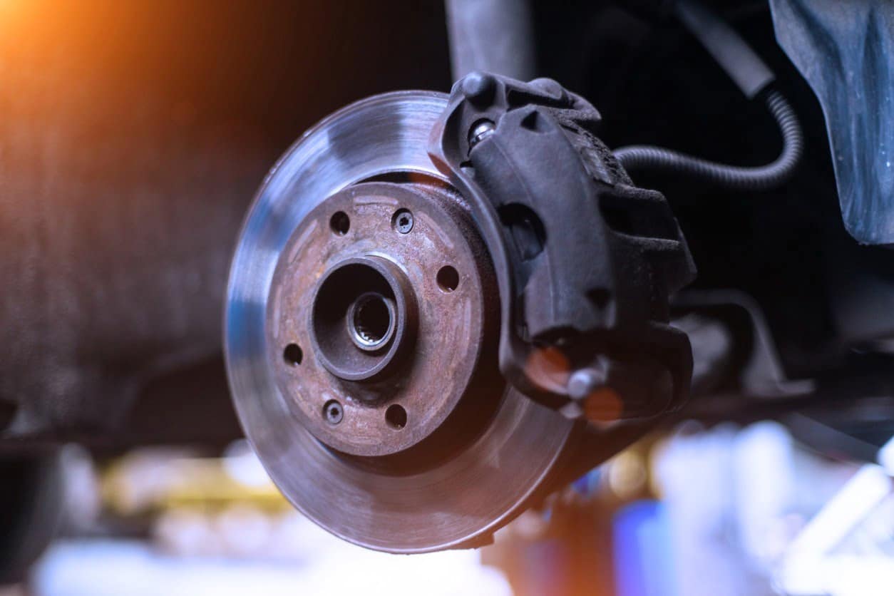car brake disk and caliper close up without wheel in cold colors with picture id1065843674